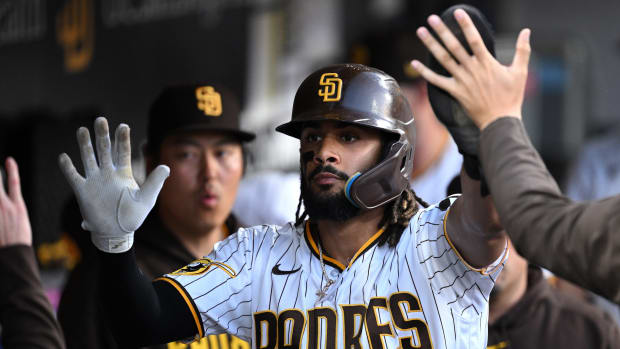 Jul 5, 2023; San Diego, California, USA; San Diego Padres right fielder Fernando Tatis Jr. (23) is congratulated in the dugout after scoring a run against the Los Angeles Angels during the seventh inning at Petco Park. Mandatory Credit: Orlando Ramirez-USA TODAY Sports  